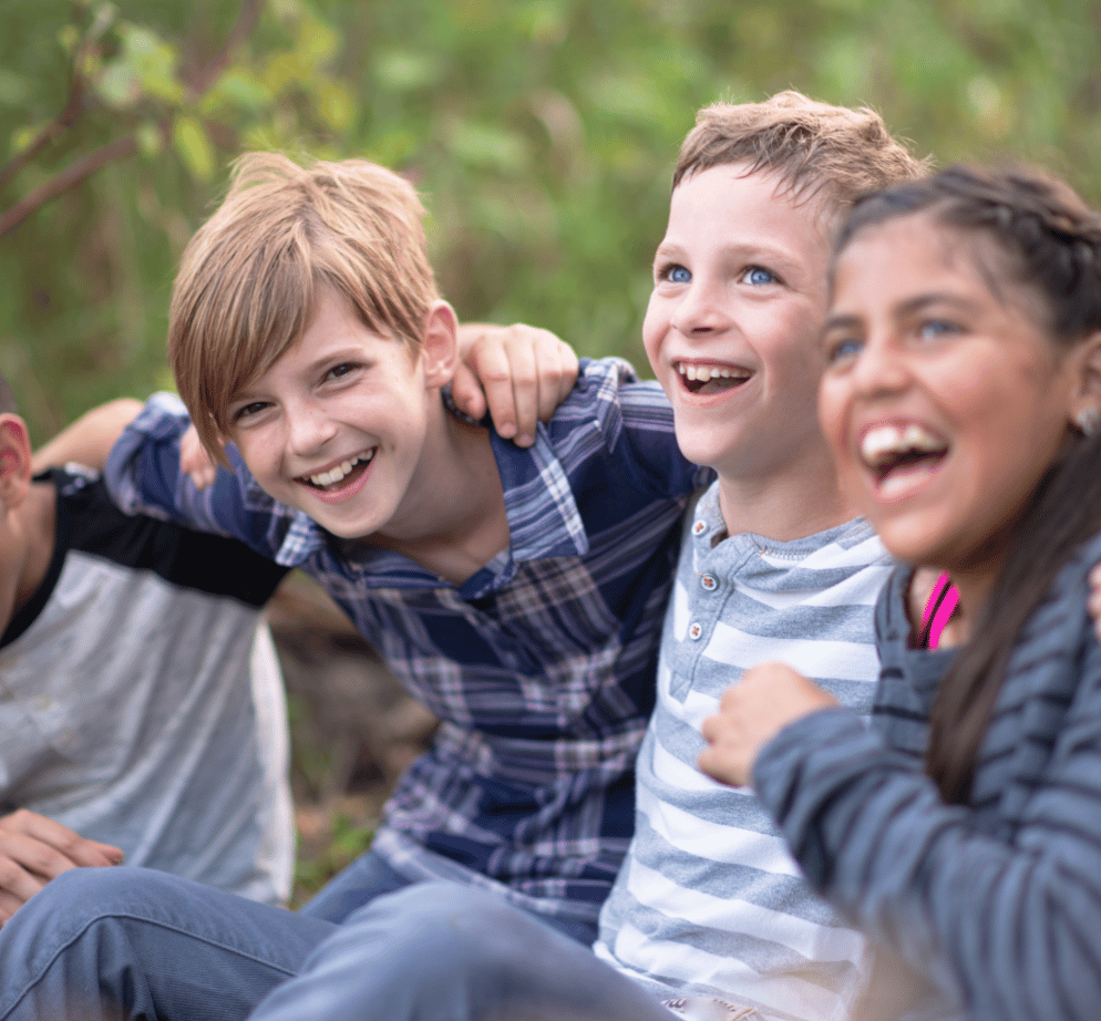 school-age children in a summer camp classroom activity