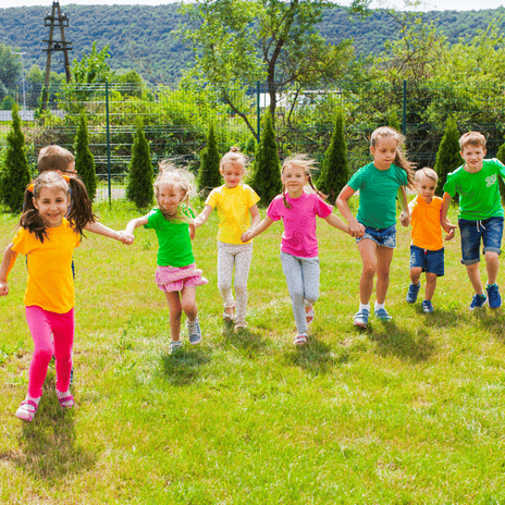 child smiling during summer camp activity